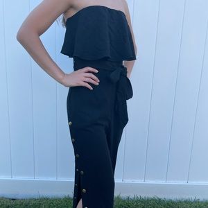 Lulu’s Black Strapless Jumpsuit with Open Leg Cutout